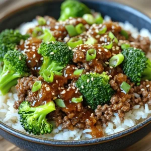 - 1 pound ground beef - 3 tablespoons soy sauce - 2 tablespoons brown sugar - 1 tablespoon sesame oil - 3 cloves garlic, minced - 1 teaspoon ginger, minced - 1/2 teaspoon red pepper flakes (adjust to taste) - 2 green onions, chopped - 1 cup broccoli florets - 1 cup cooked jasmine rice (or rice of choice) - Sesame seeds for garnish To make a Korean Ground Beef Bowl, gather these simple ingredients. Ground beef is the star here. Use 1 pound for the right amount of meat. You will also need soy sauce, brown sugar, and sesame oil to create a rich flavor. Minced garlic and ginger add depth to the dish. For a bit of heat, include red pepper flakes. Feel free to adjust this to your taste. To add some color, use broccoli florets and green onions as a garnish. Finally, serve your beef over a cup of cooked jasmine rice. You can use any rice you like. This dish is not just tasty; it’s also quick to prepare. You can find the full recipe to make this delicious bowl. Enjoy the blend of flavors as you whip this up in your kitchen! To start, you need to make a tasty marinade. In a small bowl, mix the following: - 3 tablespoons soy sauce - 2 tablespoons brown sugar - 1 tablespoon sesame oil - 3 cloves garlic, minced - 1 teaspoon ginger, minced - 1/2 teaspoon red pepper flakes (adjust to your taste) Stir these until well combined. Set this mixture aside. The marinade will add a lot of flavor to your beef. Next, it's time to cook the beef. Heat a large skillet over medium-high heat. Add 1 pound of ground beef. Cook this for about 4 to 5 minutes. Break it apart with a spatula as it cooks. Once it is browned, drain any excess fat. This step helps keep your dish from being too greasy. Now, pour the marinade over the cooked beef. Stir well to coat the beef evenly. Let it simmer for about 3 to 4 minutes. This allows the beef to soak up all those tasty flavors. Then, toss in 1 cup of broccoli florets. Cover the skillet and cook for another 3 to 4 minutes. You want the broccoli to be tender but still crisp. While this cooks, prepare 1 cup of jasmine rice according to package instructions. Once everything is ready, you can assemble your bowl. Don't forget to check out the Full Recipe for more details. When cooking ground beef, get the heat just right. Start with medium-high heat. This helps the beef brown nicely. Browning adds a lot of flavor. Stir the meat often. Break it apart with a spatula. Cook it for about 4-5 minutes. If there's too much fat, drain it away. For the broccoli, use a medium heat. This helps keep the broccoli crisp. Add it after you mix in the marinade. Cover the skillet for about 3-4 minutes. This way, the broccoli cooks evenly. It should be tender, but not mushy. To make your Korean Ground Beef Bowl shine, think about sides. A light salad or pickled veggies work well. They add crunch and balance to the meal. You could also serve it with kimchi. When assembling your bowl, start with rice. Place a scoop in each bowl first. Then, add the beef and broccoli mix on top. Finish with chopped green onions and sesame seeds. This adds color and flavor. Want to make your dish pop? Use spices and aromatics. You can add more garlic or ginger for depth. A splash of lime juice can brighten things up. If you like heat, try adding more red pepper flakes. Feel free to mix in other flavors too. A bit of honey or sriracha can change the taste. Experiment until you find your favorite combo. This dish can be your canvas! For the full recipe, check out the details above. {{image_2}} You can swap out beef for chicken, turkey, or tofu. Each option brings a unique taste. Ground chicken or turkey works well. They cook fast and absorb flavors. Tofu is a great choice for a plant-based meal. Just crumble it and cook like ground beef. This makes it a versatile dish for everyone. Adding more veggies makes your bowl colorful and healthy. Bell peppers, carrots, and snap peas are great choices. You can also try zucchini or mushrooms for extra flavor. Feel free to mix and match based on what you like. Each veggie adds its own taste and texture, making your meal exciting. Sauces can change the whole dish. Besides the marinade, try adding a spicy gochujang sauce for heat. A sweet and tangy sesame dressing also works well. You can even drizzle some sriracha for a kick. Explore these options to find your favorite combination. Each dressing adds flair to your meal and makes it unique. For the full recipe, check out the Korean Beef Delight Bowl. To store your Korean Ground Beef Bowl, let it cool first. Place the beef and broccoli in an airtight container. You can keep it in the fridge for up to three days. This helps keep it fresh and tasty. When ready to eat, just take it out and enjoy. You can freeze the beef mixture for later meals. First, cool it completely. Then, put it in a freezer-safe container. Make sure to leave some space at the top for expansion. You can freeze it for up to three months. When you want to use it, thaw it overnight in the fridge. When reheating, use a skillet for the best flavor. Add a splash of water or broth to keep it moist. Heat over medium until warm. You can also microwave it. Just cover with a damp paper towel to keep it from drying out. Enjoy it as if it’s fresh! For a full recipe, please check the [Full Recipe]. To add spice, you can increase red pepper flakes. Start with an extra half teaspoon. You can also add fresh sliced chili peppers. Another option is to drizzle in some sriracha or gochujang. Each of these options gives a unique kick. Taste your dish as you go to find the right heat. Yes, you can meal prep this dish! Cook the beef and broccoli ahead of time. Store them in separate containers. Cook your rice fresh or store it in the fridge. This way, you can enjoy your bowl anytime. Just heat everything up when you’re ready to eat. This bowl pairs well with several sides. Try serving it with kimchi for a tangy crunch. You can also add pickled vegetables for extra flavor. A simple salad with sesame dressing works great too. These sides will enhance your meal and add variety. To make this recipe gluten-free, substitute soy sauce with tamari. Tamari is a gluten-free soy sauce. You can also use coconut aminos as a soy sauce alternative. Both options keep your dish tasty and safe for gluten-sensitive diets. Enjoy the same great flavor without the gluten! This blog post described how to make a Korean Ground Beef Bowl using simple ingredients and steps. You learned to prepare a flavorful marinade and cook the beef just right. I shared tips on how to customize your dish and serve it well. Remember, you can swap proteins or add veggies for variety. Store leftovers wisely and reheat them for delicious meals later. Enjoy your cooking adventure, and make this dish your own with fun twists!