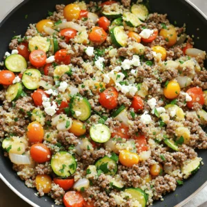 - 1 lb (450g) ground beef - 1 medium onion, diced - 2 cloves garlic, minced - 1 red bell pepper, sliced - 1 zucchini, sliced - 1 cup cherry tomatoes, halved - 1 cup cooked quinoa (or couscous) - 2 tablespoons olive oil - 1 tablespoon ground cumin - 1 tablespoon smoked paprika - ½ teaspoon dried oregano - Salt and pepper to taste - Fresh parsley, chopped (for garnish) - Feta cheese crumbles (optional) When measuring your ingredients, use a scale for accuracy. A kitchen scale helps you get the right amount of ground beef. For liquids like olive oil, a measuring cup works well. If you don’t have a scale, use standard measurements. For example, one cup equals eight ounces. This ensures your dish turns out just right. Fresh ingredients bring more flavor and color to your dish. I love using fresh produce like cherry tomatoes and zucchini. They enhance texture and taste. However, dried herbs, like oregano, are excellent too. They add depth and can be easier to store. Just remember, dried herbs are stronger than fresh. Use about one-third the amount when substituting. So, if you want to use dried oregano instead of fresh, just use a teaspoon instead of a tablespoon. To make the Mediterranean ground beef stir fry, start by gathering your ingredients. You will need: - 1 lb ground beef - 1 medium onion, diced - 2 cloves garlic, minced - 1 red bell pepper, sliced - 1 zucchini, sliced - 1 cup cherry tomatoes, halved - 1 cup cooked quinoa (or couscous) - 2 tablespoons olive oil - 1 tablespoon ground cumin - 1 tablespoon smoked paprika - ½ teaspoon dried oregano - Salt and pepper to taste - Fresh parsley, chopped (for garnish) - Feta cheese crumbles (optional) Wash and slice all your veggies. Dice the onion, mince the garlic, and prepare the bell pepper and zucchini. Halve the cherry tomatoes for quick cooking. Start by heating the olive oil in a large skillet or wok over medium-high heat. Add the ground beef and break it apart with a spatula. Cook for about 5-7 minutes until it turns brown. Be sure to drain any extra fat from the meat. Next, add the diced onion and minced garlic. Sauté these for about 2-3 minutes until the onion becomes translucent. Then, mix in the red bell pepper, zucchini, and cherry tomatoes. Stir-fry everything together for another 5-7 minutes. This will keep your veggies tender and crisp. Now it's time to season! Sprinkle in the cumin, smoked paprika, oregano, salt, and pepper. Stir well to coat everything with the spices. After that, add the cooked quinoa or couscous. Mix it in until everything is hot, about 2-3 minutes. To serve, remove the skillet from heat. Dish the stir-fry into bowls and sprinkle fresh parsley on top. If you like, add feta cheese crumbles for a creamy touch. This dish works great alongside a simple green salad. For the full recipe, check the earlier section. Enjoy your meal! To boost flavor, use fresh herbs. Fresh parsley adds a bright taste. Use high-quality olive oil for rich depth. Don't skip the spices; cumin and smoked paprika make a big difference. Cook the beef until it's nicely browned for a deeper flavor. Sauté the onions and garlic until soft. The aroma will fill your kitchen! One mistake is overcooking the vegetables. You want them tender but still crisp. Another common error is not seasoning enough. Taste as you go and adjust spices. Also, avoid cooking at too low a heat. High heat creates a nice sear on the beef. Finally, don’t skip the quinoa or couscous; they add great texture. You will need a large skillet or wok for this recipe. A good spatula helps break up the beef easily. Use a sharp knife to slice vegetables quickly. A cutting board is essential for prep. Measuring spoons ensure you get the right amount of spices. These tools make cooking simple and fun! For the full recipe, check out the details provided earlier. {{image_2}} You can easily swap ground beef for other meats. Try ground turkey or chicken for a lighter dish. If you want a vegetarian option, use lentils or chickpeas. These choices still pack a flavor punch. Each option brings a unique taste and texture. Feel free to change the veggies in this stir fry. Broccoli, carrots, or spinach work well. You can even add mushrooms for an earthy flavor. Use what you have on hand to keep it fresh. Mixing different veggies can create fun textures in your dish. If you want to switch up the grain, try brown rice or farro. Each grain adds its own flavor and chewiness. You can also use cauliflower rice for a low-carb option. It’s a great way to keep your meal light and healthy. For more ideas, check the full recipe. After cooking, let your Mediterranean Ground Beef Stir Fry cool for about 30 minutes. Then, place it in an airtight container. This helps keep it fresh. Store it in your fridge for up to 3 days. Always check for any off smells or changes in texture before eating. If you want to save some for later, freezing is a great option! Allow the stir fry to cool completely. Then, use freezer-safe bags or containers. You can freeze it for up to 3 months. Make sure to label the bags with the date to keep track. When you're ready to enjoy your stir fry again, take it out of the fridge or freezer. If frozen, let it thaw in the fridge overnight. Reheat in a skillet over medium heat for about 5-7 minutes. Stir occasionally to ensure it warms evenly. You can add a splash of water or broth to keep it moist. Enjoy your tasty meal! If you want a different grain, try couscous or rice. Both options work well in this dish. You can also use farro or barley for a nutty flavor. These grains hold sauces nicely and make the meal filling. Just remember to cook them before adding them to the stir fry. Yes, you can make the Mediterranean Ground Beef Stir Fry ahead of time. It tastes great when reheated. Just cook it and let it cool. Store it in an airtight container in your fridge. You can keep it for up to three days. When ready to eat, just warm it in a pan or microwave. This makes it a perfect meal prep option. You can serve this stir fry with a fresh green salad. A simple side of steamed vegetables is also great. Garlic bread or pita chips can add a nice crunch. You might even consider a yogurt sauce for dipping. These sides will enhance the flavors and make your meal more enjoyable. In this article, we explored how to make a tasty Mediterranean Ground Beef Stir Fry. You learned about the right ingredients, cooking steps, and helpful tips. I shared ways to avoid common mistakes and suggestions for storing leftovers. Remember, you can swap out the ground beef or choose different veggies to suit your taste. Don’t hesitate to get creative! Cooking should be fun, and this dish is a great way to enjoy diverse flavors. Enjoy your cooking journey and explore Mediterranean flavors!