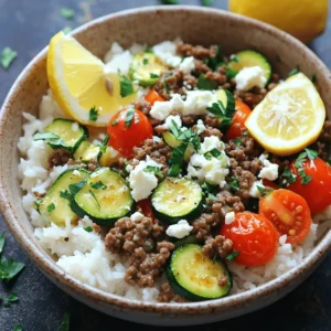 To make a delicious Greek beef and zucchini rice bowl, you need some key ingredients: - 1 lb ground beef - 1 large zucchini, diced - 1 cup basmati rice These ingredients create a solid base for your dish. The ground beef gives the meal its hearty flavor. Zucchini adds a lovely texture and freshness. Basmati rice serves as a fluffy backdrop for all those tasty elements. You can enhance your dish with these optional ingredients: - Fresh parsley - Feta cheese - Cherry tomatoes Adding fresh parsley gives your bowl a nice pop of color. Feta cheese adds a creamy, salty touch that complements the beef. Cherry tomatoes bring sweetness and a burst of flavor. You will also need some common pantry items: - Olive oil - Dried oregano - Ground cumin - Paprika - Salt and pepper These staples boost the flavor of your dish. Olive oil helps cook the beef and veggies. Dried oregano and ground cumin add a warm, earthy taste. Paprika gives a mild smokiness, while salt and pepper round out all the flavors. For the complete step-by-step process, refer to the Full Recipe. 1. Rinse and drain basmati rice: Rinse one cup of basmati rice under cold water. Keep rinsing until the water is clear. This step helps remove extra starch. After rinsing, drain the rice and set it aside. 2. Sauté onions and garlic: In a medium saucepan, heat one tablespoon of olive oil over medium heat. Add one small chopped onion. Sauté it until it becomes soft and translucent, about three to four minutes. Next, add two minced garlic cloves. Cook for an additional thirty seconds until the garlic is fragrant. 1. Browning the ground beef: In a large skillet, heat the other tablespoon of olive oil over medium-high heat. Add one pound of ground beef to the skillet. Use a spatula to break it apart. Cook the beef until it is browned, about five to seven minutes. Season it with one teaspoon of dried oregano, one teaspoon of ground cumin, and half a teaspoon of paprika. Add salt and pepper to taste. Stir well. 2. Adding zucchini and tomatoes: Chop one large zucchini into small pieces and halve one cup of cherry tomatoes. Add both to the skillet with the beef. Sauté for about five minutes, until the zucchini is tender. 1. Fluffing rice and mixing with beef: Once the rice is cooked and the liquid is absorbed, fluff it with a fork. Then, divide the rice into serving bowls. Top each bowl with the beef and zucchini mixture. 2. Plating the dish: Finish your dish by sprinkling half a cup of crumbled feta cheese and some fresh parsley over the top. You can also add a wedge of lemon on the side for a zesty touch. For full details and additional tips, check the Full Recipe. How to properly sauté vegetables To sauté vegetables well, use medium heat. Heat olive oil in your pan. Add onions first; cook until they turn soft. This usually takes about three to four minutes. Then, add zucchini and cook until tender. Stir often to prevent sticking. This method keeps your veggies crisp and full of flavor. Achieving the best texture for rice For the best rice texture, rinse basmati rice under cold water. This removes excess starch, which makes the rice less sticky. After rinsing, drain the rice well. When cooking, use a 2-to-1 ratio of vegetable broth to rice. This gives the rice a rich flavor. Simmer it gently to let it absorb the liquid fully. Balancing flavors with spices Use dried oregano and ground cumin for a classic Greek taste. They add warmth and depth to the beef. Start with a teaspoon of each. You can adjust these spices according to your taste. Try adding a pinch of paprika for a hint of smokiness. Adjusting seasoning to taste Always taste your dish as you cook. If it needs more flavor, add salt and pepper. This simple step helps you achieve a balanced taste. Remember, you can always add more, but you can't take it out. Garnishing with feta and parsley To make your bowl look inviting, sprinkle crumbled feta cheese on top. The creamy cheese pairs well with the beef. Fresh parsley adds a pop of color. Use a generous handful for a bright look. Serving suggestions for a colorful plate Use colorful bowls to enhance your dish's appeal. Add a lemon wedge on the side for a fresh touch. This not only looks good but also adds a zesty flavor when squeezed over the bowl. Enjoy your Greek Beef and Zucchini Rice Bowl with these fun and easy tips! {{image_2}} You can make this dish healthier by changing a few key ingredients. Instead of ground beef, try ground turkey or chicken. These options are leaner and lower in fat. They still offer great flavor. If you prefer plant-based meals, swap the beef for lentils or chickpeas. Both options add protein and fiber. They also soak up the spices well, giving your bowl a tasty twist. To elevate the flavors, add fresh herbs like dill or mint. These herbs can brighten the dish and add depth. You can also mix in other vegetables. Some great choices include bell peppers, spinach, or roasted eggplant. They add color and more nutrition. For a different base, serve your Greek beef and zucchini mixture over quinoa or cauliflower rice. Both options are nutritious and add a unique texture. Pair it with a side salad for a balanced meal. A simple green salad with olive oil and lemon dressing works well. It adds freshness and crunch to your plate. For the full recipe, check out the complete instructions! To keep your Greek Beef and Zucchini Rice Bowl fresh, store leftovers in an airtight container. This will help maintain flavor and texture. It stays good in the fridge for about three to four days. When you're ready to eat, just reheat it on the stove or in the microwave. You can freeze the Greek Beef and Zucchini Rice Bowl for longer storage. Portion it into freezer-safe containers. Make sure to leave some space at the top, as the rice may expand. It’s best to use it within three months. When you’re ready to enjoy it, thaw it in the fridge overnight. Reheat on the stove for the best flavor. For easy meal prep, cook the beef and rice in advance. You can also chop the zucchini and tomatoes beforehand. Store these ingredients separately to keep them fresh. This way, you can mix and match when you’re ready to eat. It makes meal time quick and easy, with minimal effort! For the full recipe, check out the [Full Recipe]. Can I make this dish ahead of time? Yes, you can prep this dish ahead. Cook the beef and rice separately. Store them in the fridge. This way, you save time and enjoy fresh meals. What can I substitute for basmati rice? You can use jasmine rice or quinoa instead of basmati rice. Both options cook well and will taste great in this dish. How many calories are in each serving? Each serving has around 450 calories. This can vary with portion sizes and added toppings. Is this recipe suitable for special diets? Yes, it's flexible! You can use lean beef for lower fat. For gluten-free diets, skip the broth with gluten. How do I make the beef less greasy? To reduce grease, use lean ground beef. Drain excess fat after cooking. This keeps the dish light and healthy. What should I do if my rice is too sticky? If your rice is sticky, try rinsing it before cooking. Also, fluff it gently with a fork after cooking. This helps separate the grains. For the full recipe, check out the detailed guide. In this blog post, we explored how to make a Greek Beef and Zucchini Rice Bowl. We covered essential and optional ingredients, tips for cooking, and variations to try. You can customize flavors and textures based on your preference. Remember, meal prep can save time, and proper storage keeps leftovers fresh. Cooking at home with these simple steps can boost your meals and encourage healthy eating. Enjoy creating your dish and make it your own. Happy cooking!