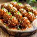 - 1 lb ground beef (or mix of beef and pork) - 1/2 cup breadcrumbs - 1/4 cup grated Parmesan cheese - 1/4 cup chopped green onions - 1 large egg - 2 cloves garlic, minced To make these meatballs, you need a good base. Ground beef gives them flavor and texture. A mix of beef and pork adds more taste. Breadcrumbs help bind everything together. Parmesan cheese adds a nice salty kick. Green onions give a fresh crunch. The egg helps hold the meatball shape, while garlic brings a rich aroma. - 1/2 teaspoon salt - 1/4 teaspoon black pepper - 1 cup sweet chili sauce - 1 tablespoon soy sauce - 1 tablespoon rice vinegar - 1 tablespoon sriracha (to taste) Seasoning is key for flavor. Salt and pepper enhance the meat's taste. Sweet chili sauce is the main ingredient, giving it a sweet and spicy vibe. Soy sauce adds depth, while rice vinegar brightens it up. Sriracha is perfect for spice lovers. Adjust it based on how spicy you want your dish. - Sesame seeds - Extra chopped green onions Garnishing makes the dish pop. Sesame seeds add a nutty flavor and crunch. Extra green onions not only look nice but also add freshness. These simple touches make your meatballs fun and inviting. - Mix all meatball ingredients in a bowl. - The ingredients are ground beef, breadcrumbs, Parmesan cheese, green onions, egg, garlic, salt, and pepper. - Be gentle when mixing. You want it well blended but not tough. - Form the mixture into small meatballs, about 1 inch wide. - Place each meatball on a baking tray. Aim for about 20-24 meatballs. - In a separate bowl, whisk together the sauce ingredients. - The sauce includes sweet chili sauce, soy sauce, rice vinegar, and sriracha. - Adjust the sriracha amount based on how spicy you like it. - Lightly coat the bottom of your crockpot with cooking spray or olive oil. - Arrange the meatballs in the crockpot in a single layer. - Pour the sauce over the meatballs. Ensure they are well coated. - Cover the crockpot and cook on low for 4-5 hours or high for 2-3 hours. - Check that the meatballs are cooked through and tender before serving. To make great meatballs, you must not overwork the meat. This keeps them tender. Mix the ingredients until they just come together. A few lumps are okay. When forming meatballs, aim for about one inch in size. This helps them cook evenly. Cooking time may vary. If you like softer meatballs, cook them on low for 5 hours. For firmer meatballs, cook on high for 2-3 hours. Adding extra spices can boost flavor. Consider paprika for a smoky touch. You can also add dried oregano for freshness. If you want heat, sriracha is your friend. Start with one tablespoon, then taste. Add more if you like it spicy. This way, you control the heat level. For a beautiful dish, garnishing is key. Sprinkle sesame seeds on top for crunch. Add extra chopped green onions for color. Serve the meatballs in a nice dish. You can also drizzle sauce over them before serving. This makes them look appealing and appetizing. Serve them with toothpicks for easy eating at parties. {{image_2}} You can switch up the protein in the meatballs. Ground turkey or chicken works great. These meats are lean and tasty. For a meatless option, try plant-based meat. It holds flavor well and keeps the dish fun. You can play with the sweet chili sauce too. Consider using a homemade version for more control. Mix honey and soy sauce for a sweet twist. Or add garlic and ginger for a kick. Adjusting the sauce ingredients gives you a new flavor each time! How you serve these meatballs can change the game. Try them in a sub with melted cheese. They make great appetizers too. You can serve them over rice or noodles for a hearty meal. Each style offers a new way to enjoy the dish! To store leftovers, let the meatballs cool first. Place them in an airtight container. You can keep them in the fridge for up to three days. Make sure to cover the meatballs with some sauce to keep them moist. If you want to freeze your meatballs, wait until they cool completely. Arrange them in a single layer on a baking sheet. Freeze them for about an hour until firm. Then, move them to a freezer bag. They can last up to three months in the freezer. Remember to remove as much air as you can from the bag. To reheat, you have a few options. For the best flavor, heat them in a pot on the stove. Add a splash of water or sauce to keep them moist. You can also use a microwave. Heat them in short bursts, stirring in between. Check to make sure they are hot all the way through. Enjoy your sweet chili flavor again! You can serve these meatballs with many sides. Rice is a great choice. It soaks up the sauce well. You can also serve them with noodles for a fun twist. A fresh salad can balance the meal nicely. Try adding steamed veggies for color and crunch. Yes, you can make these meatballs ahead! You can mix the meatball mixture and form the balls. Then, store them in the fridge for up to a day. You can also cook them and save for later. They keep well in the fridge for a few days. To serve more, just double the ingredients. For fewer servings, cut the recipe in half. This dish is flexible. You can easily scale it up or down based on your needs. Just keep an eye on cooking time if you change the amount. Yes, you can make this recipe gluten-free! Use gluten-free breadcrumbs instead of regular ones. Check the soy sauce label for gluten-free options. This way, you can enjoy the meatballs without worry. Leftovers will last about 3 to 4 days in the fridge. Make sure to store them in an airtight container. If you want to keep them longer, consider freezing. Frozen meatballs can last for up to 3 months. Just thaw and reheat when you’re ready to eat! In this blog post, we explored how to make sweet chili crockpot meatballs. We covered all the main ingredients and the step-by-step method for cooking. I shared tips for perfecting your meatballs and variations to suit your taste. Remember, you can easily change proteins or sauces based on what you have. Enjoy these meatballs as a snack, meal, or fun appetizer. With proper storage, leftovers will stay fresh. Get creative and make this tasty dish your own!