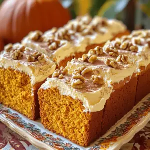 - 2 cups all-purpose flour - 1 teaspoon baking soda - 1 teaspoon baking powder - 1 teaspoon ground cinnamon - 1/2 teaspoon ground nutmeg - 1/4 teaspoon ground ginger - 1/2 teaspoon salt - 1 cup granulated sugar - 1 cup brown sugar, packed - 1 cup vegetable oil - 4 large eggs - 2 cups pure pumpkin puree (canned or fresh) - 1 teaspoon vanilla extract - 8 oz cream cheese, softened - 1/4 cup unsalted butter, softened - 2 cups powdered sugar - 1 teaspoon vanilla extract - 1-2 tablespoons milk (as needed for consistency) Gather these ingredients before you start. Each one plays a key role in making your pumpkin bread rich and moist. The dry ingredients create a perfect base, while the wet ingredients add flavor and texture. The cream cheese frosting makes it all come together for a delightful finish. You can adjust the sweetness by using more or less sugar in the wet mix. Also, feel free to add nuts for a crunchy texture. - Preheat oven to 350°F (175°C). - Prepare two 9x5 inch loaf pans. Start by setting your oven to 350°F. This heat helps the bread rise and bake evenly. Next, grab two loaf pans. You can grease and flour them or line them with parchment paper. This makes it easy to take the bread out later. - Combine dry ingredients. - Blend wet ingredients thoroughly. - Mix dry and wet ingredients together. Now, let’s mix the ingredients. In a medium bowl, whisk together the dry ingredients. This includes flour, baking soda, baking powder, cinnamon, nutmeg, ginger, and salt. Make sure they are well blended. In a large bowl, mix the granulated sugar, brown sugar, and vegetable oil. Stir until it looks smooth. Then, add the eggs, pumpkin puree, and vanilla extract. Beat this mixture until it is creamy. Next, slowly mix the dry ingredients into the wet mixture. Stir just until they blend. Be careful not to overmix. If you want, fold in some chopped walnuts or pecans for a nice crunch. - Pour batter into loaf pans. - Bake for 60-70 minutes. - Cooling process after baking. Now it’s time to bake! Pour the batter evenly into the loaf pans. Place them in the oven and bake for 60 to 70 minutes. Your bread is done when a toothpick comes out clean from the center. Once baked, take the loaves out of the oven. Let them cool in the pans for about 10 minutes. After that, move the loaves to a wire rack. Let them cool completely before adding the cream cheese frosting. - Avoid overmixing the batter. Overmixing can make your bread tough. Mix just until you see no dry flour. This keeps your bread soft and fluffy. - Use a toothpick test for doneness. Insert a toothpick in the center of the bread. If it comes out clean, your bread is done. If it has wet batter, bake for a few more minutes. - Achieving the right consistency for cream cheese frosting is key. Start with softened cream cheese and butter. Gradually add powdered sugar. If it’s too thick, add milk a little at a time until smooth. - How to store leftover frosting? Place it in an airtight container in the fridge. It will stay fresh for about a week. When ready to use, let it warm up and mix well before spreading. - Decorative garnishes for serving can enhance your dish. Consider adding chopped walnuts or a sprinkle of cinnamon on top. This adds a nice touch and makes it look inviting. - Ideal serving suggestions include slicing the bread into thick pieces. Arrange them on a pretty platter. Pair with spiced chai or a warm drink for a cozy treat. {{image_2}} You can easily boost the flavors in your pumpkin bread. Try adding different spices like allspice or cloves. They give the bread a warm, rich taste. You can also mix in chocolate chips or dried fruits. Both add sweetness and texture to each bite. My favorite is using dark chocolate chips. They melt slightly, making each slice delightful. If you need a gluten-free option, replace all-purpose flour with a gluten-free blend. Many blends work well in this recipe. For a vegan version, swap the eggs with flax eggs. Mix one tablespoon of ground flaxseed with three tablespoons of water. Let it sit for a few minutes to thicken. You can also use a plant-based milk in the frosting. These changes keep the taste while meeting dietary needs. While cream cheese frosting is a classic choice, you can explore other toppings. Maple frosting is a wonderful option. It adds a sweet, earthy flavor that pairs well with pumpkin. Another simple choice is a dusting of powdered sugar. It looks pretty and adds just a hint of sweetness. You can even top your bread with chopped nuts for extra crunch. To keep your pumpkin bread fresh, store it in an airtight container. You can refrigerate it for up to one week. If you want to store it longer, freeze it. Wrap the cooled bread tightly in plastic wrap and place it in a freezer bag. It can last for about three months in the freezer. When you're ready to enjoy it, just thaw it overnight in the fridge. Reheating your pumpkin bread is simple. You can use the oven or microwave. For the oven, preheat it to 350°F (175°C). Place the bread on a baking tray and warm it for about 10-15 minutes. For the microwave, heat a slice for about 15-20 seconds. To keep the bread moist when reheating, cover it with a damp paper towel in the microwave. This adds a little steam and prevents it from drying out. Enjoy your warm, tasty treat! Yes, you can use fresh pumpkin puree. Fresh pumpkin can taste richer and more vibrant. It may also have a thicker texture, giving your bread a more unique mouthfeel. To make fresh puree, roast pumpkin slices until soft, then blend until smooth. Canned pumpkin is convenient and consistent, making it a great option as well. Both options yield a delicious pumpkin bread. You can check for doneness easily. Insert a toothpick into the center of the bread. If it comes out clean or with a few moist crumbs, your bread is done. The top should also spring back when lightly pressed. Another sign is a golden-brown color on the crust. Keep an eye on the bread near the end of the baking time. You can add many types of nuts to your pumpkin bread. Chopped pecans add a sweet, buttery flavor. Walnuts give a nice crunch and a slightly bitter taste that balances the sweetness. Almonds can bring a light, nutty note. Hazelnuts offer a rich flavor that pairs well with pumpkin. Feel free to experiment and find your perfect mix! This article covered all you need to know about making delicious pumpkin bread. We discussed the right ingredients, step-by-step instructions, and helpful tips to ensure success. You can also try various flavors and dietary options for your recipe. Remember to store your bread properly to keep it fresh. With these insights, you're ready to bake a perfect loaf. Enjoy making this tasty treat and share it with friends and family!