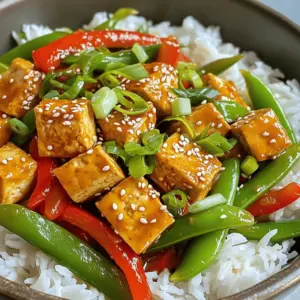 - 14 oz block of firm tofu, pressed and cubed - 1 red bell pepper, sliced - 1 cup snap peas, trimmed - 2 green onions, chopped - 3 cloves garlic, minced - 1 tablespoon fresh ginger, grated - 3 tablespoons soy sauce or tamari - 1 tablespoon sriracha - 1 tablespoon sesame oil - 1 tablespoon honey or maple syrup - Sesame seeds - Lime wedges In this Minute Chili Garlic Tofu Stir-Fry, I focus on fresh ingredients. Firm tofu forms the base of this dish. I always press the tofu to remove water. This step helps it fry better and adds more flavor. For veggies, I use red bell pepper and snap peas. They provide crunch and color. Green onions add a fresh taste. Garlic and ginger give a fragrant base. I find these aromatics essential for flavor. The sauces bring the dish together. Soy sauce or tamari adds saltiness. Sriracha gives heat. You can adjust the spice to match your taste. Sesame oil adds a nutty finish, while honey or maple syrup adds a touch of sweetness. For a fun twist, I often add sesame seeds on top. Lime wedges freshen the dish and add a zesty kick. These ingredients combine to create a quick and flavorful meal. How to press and cube tofu To start, you need to press the tofu to remove extra water. Wrap the tofu in a clean kitchen towel. Place a heavy object on top, like a cast-iron skillet. Leave it for about 15 minutes. This helps the tofu absorb more flavor later. After pressing, cut the tofu into small cubes, about one inch each. Cooking tofu to golden perfection Heat two tablespoons of vegetable oil in a large skillet over medium-high heat. Once hot, add the cubed tofu. Cook the tofu for 4 to 5 minutes. Stir it often to get all sides golden brown. This gives it a nice texture and flavor. When done, remove the tofu from the skillet and set it aside. Sauteing garlic and ginger In the same skillet, add three minced garlic cloves and one tablespoon of grated ginger. Sauté for about 30 seconds. You want it to smell great, but be careful not to burn it. The aroma is key. Adding and cooking the bell pepper and snap peas Next, add one sliced red bell pepper and one cup of trimmed snap peas. Stir-fry these for about 2 to 3 minutes. You want them tender but still crisp. This keeps the colors bright and the flavors fresh. Returning tofu to skillet Now, it’s time to add the tofu back to the skillet. Make sure it’s well mixed with the veggies. Incorporating sauces and mixing well Pour in three tablespoons of soy sauce, one tablespoon of sriracha, and one tablespoon of sesame oil. Add one tablespoon of honey or maple syrup for sweetness. Stir everything well and cook for another 2 minutes. This lets all the flavors blend. Finally, sprinkle chopped green onions on top and mix gently. Serve the stir-fry over cooked rice or quinoa. Add sesame seeds for a nice touch. Enjoy your quick and tasty meal! To get crispy, golden tofu, follow these steps: - Press the tofu: Remove moisture first. Wrap it in a clean towel and place a heavy object on top for 15-30 minutes. - Cut into cubes: Slice the pressed tofu into bite-sized pieces. This helps with even cooking. - Heat your oil: Use a hot skillet with vegetable oil. This helps brown all sides well. - Do not overcrowd: Cook the tofu in batches if your skillet is small. This ensures even browning. You can also try different cooking methods: - Air frying: Cook at 375°F (190°C) for 15-20 minutes. This gives a nice crunch. - Baking: Spread cubed tofu on a baking sheet. Bake at 400°F (200°C) for 25-30 minutes, flipping halfway. Adjusting spice levels is easy with sriracha. If you want it milder, use less sriracha. For more heat, add extra. Consider these seasonings for depth: - Garlic powder: Adds a nice kick. - Onion powder: Enhances the savory taste. - Cumin: Offers a warm, earthy tone. Mixing these into your sauce can really elevate the dish. Serving your stir-fry well makes it more appealing. Here are some ideas: - Use deep bowls: They help keep the dish warm and look nice. - Garnish: Sprinkle sesame seeds and green onions on top. This adds color and crunch. - Add a lime wedge: A slice of lime adds brightness and a zesty flavor. These small touches can make your dish look restaurant-quality and impress your guests. {{image_2}} You can switch up the protein in this dish easily. Tempeh is a great choice. It adds a nutty flavor and firm texture. Just cube it like tofu and cook it in the same way. If you prefer chicken, cut it into small pieces. Cook the chicken until it's no longer pink. Both options work well and keep the dish tasty. For a vegan option, you might want to use maple syrup instead of honey. It gives you sweetness without using animal products. This makes the dish perfect for any diet. Feel free to add other veggies to your stir-fry. Broccoli, carrots, and zucchini are fantastic choices. They add color and crunch. Just chop them into bite-sized pieces. You can stir-fry them with the red bell pepper and snap peas. Think about what’s in season, too. Fresh asparagus in spring or sweet corn in summer can add new flavors. Using seasonal produce keeps your meals exciting and supports local farmers. If you need to keep this dish gluten-free, it's simple. Check the soy sauce label. Choose tamari instead, as it’s made without wheat. It’s just as tasty and works perfectly. Also, make sure any other sauces are gluten-free. Many brands offer gluten-free options now. This way, you won’t miss out on flavor while sticking to your diet. Enjoy your meal worry-free! To store leftovers, let the stir-fry cool to room temperature. Transfer it to an airtight container. Use glass or BPA-free plastic containers for best results. Make sure to seal them tightly to keep air out. To reheat the stir-fry, you have two good options. You can use the microwave or stovetop. For the microwave, place the stir-fry in a bowl and cover it with a damp paper towel. Heat it for 1-2 minutes, stirring halfway. For stovetop, heat a skillet over medium heat. Add a splash of water or oil, then stir-fry for 3-4 minutes until heated through. For the best taste and quality, eat the leftovers within 3-4 days. Keep an eye out for signs of spoilage. If the stir-fry smells off or has a strange texture, it's best to throw it out. Always trust your senses when checking for freshness. You can pair this dish with several tasty sides. Here are some great options: - Cooked rice: White or brown rice works well. - Quinoa: This adds a nutty flavor. - Noodles: Try rice noodles or soba for a different texture. - Steamed vegetables: Broccoli or bok choy add color and nutrition. - Salad: A light Asian salad can balance the meal. These sides enhance the stir-fry's flavors and provide a complete meal. Yes, you can prep this stir-fry in advance. Here are some tips: - Make the tofu: Cook and store the tofu in an airtight container. - Chop the veggies: Slice your bell pepper and trim snap peas ahead of time. - Store sauces: Mix the soy sauce, sriracha, sesame oil, and honey in a jar. For reheating, use the stovetop. Warm the stir-fry over medium heat until hot. This keeps the tofu crispy and the veggies fresh. Yes, this recipe can be gluten-free. Just make these swaps: - Soy sauce: Use tamari, a gluten-free alternative. - Honey: If vegan, opt for maple syrup, which is naturally gluten-free. Always check the labels on your ingredients to ensure they are gluten-free. Enjoy this tasty dish with peace of mind! This blog post covered a tasty chili garlic tofu stir-fry. We looked at key ingredients like tofu, fresh vegetables, and spices. I shared step-by-step instructions on how to prepare and cook the dish. Plus, I included helpful tips to perfect the texture and enhance the flavor. In the end, this recipe is easy and flexible. Try new veggies or protein sources. Enjoy making this healthy stir-fry and impress your family with great flavors! Enjoy your cooking journey!