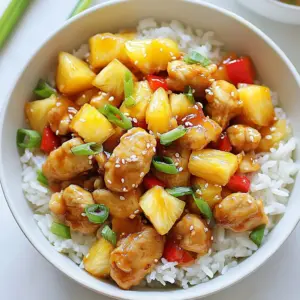 - 1 lb boneless, skinless chicken breasts, diced - 1 cup jasmine rice, rinsed - 1 can (20 oz) pineapple chunks in juice, drained (reserve juice) - 1 bell pepper (red or yellow), diced - 1 small onion, chopped - 3 cloves garlic, minced - 1 teaspoon fresh ginger, grated The main ingredients in this dish make it special. The chicken provides protein, while jasmine rice gives a nice texture. Pineapple chunks add sweetness and a tropical vibe. Bell pepper and onion bring color and crunch. Garlic and ginger give bold flavors. - 1 cup chicken broth - 2 tablespoons soy sauce - 2 tablespoons olive oil - Salt and pepper to taste - Green onions, sliced (for garnish) - Sesame seeds (for garnish) Seasoning is key to making this dish shine. Chicken broth adds depth, while soy sauce gives it umami. Olive oil helps to cook the chicken and veggies. Salt and pepper enhance all the flavors. For garnish, green onions and sesame seeds not only look good but also add extra flavor. {{ingredient_image_1}} - Heat 2 tablespoons of olive oil in a large skillet over medium heat. - Add 1 pound of diced chicken breasts. Season with salt and pepper. - Cook the chicken for about 6 to 8 minutes until it is browned. - Remove the chicken from the skillet and set it aside. - In the same skillet, add 1 small chopped onion and 1 diced bell pepper. - Add 3 minced garlic cloves to the skillet as well. - Sauté these for about 3 to 4 minutes until they are soft and fragrant. - This step adds great flavor to your dish. - Add 1 cup of rinsed jasmine rice to the skillet. - Stir in 1 teaspoon of grated fresh ginger. - Toast the rice for about 2 minutes. This helps to enhance its flavor. - Now, pour in the reserved pineapple juice, 1 cup of chicken broth, and 2 tablespoons of soy sauce. - Stir well to mix all the ingredients together. - Bring the mixture to a simmer, then cover the skillet with a lid. - Lower the heat and cook for 15 to 18 minutes. The rice should be tender, and the liquid should absorb. - After the rice is cooked, gently stir in the cooked chicken and 1 can of drained pineapple chunks. - Cook for an additional 2 to 3 minutes to warm everything through. - Remove from heat and let it sit covered for 5 minutes. This helps all the flavors meld together. To ensure your chicken is cooked through, use a meat thermometer. The chicken should reach 165°F (75°C). Cut the chicken into small pieces. This helps it cook evenly. When browning chicken, do not crowd the skillet. Cook in batches if needed. For the rice, jasmine rice gives a nice flavor. Rinse it well before cooking. This removes excess starch and keeps the rice fluffy. When simmering, cover the skillet tightly. This traps steam and helps the rice cook evenly. To boost the flavor, add spices like paprika or cumin. You can also use fresh herbs like cilantro or basil. They add a bright taste to the dish. Consider marinating the chicken ahead of time. Mix soy sauce, ginger, and garlic together. Let the chicken soak in this mix for at least 30 minutes. This makes the chicken more flavorful and tender. You can also try adding lime juice for a tangy twist. Pro Tips Use Fresh Ingredients: Fresh chicken and vegetables will enhance the flavors of your dish and provide a better texture. Toast the Rice: Toasting the rice for a couple of minutes before adding liquid brings out a nuttier flavor, making the dish more aromatic. Adjust for Sweetness: Depending on your preference, you can add more soy sauce or a splash of vinegar to balance the sweetness of the pineapple. Let it Rest: Allowing the skillet to sit covered after cooking lets the flavors meld together, resulting in a more cohesive dish. {{image_2}} If you want to change up the texture, try using brown rice instead of jasmine. Brown rice has more fiber and a nice nutty taste. It cooks longer, so add an extra 10-15 minutes to your cooking time. You can also swap the chicken for tofu or shrimp. Tofu gives a nice plant-based option. Press it first to remove extra water, then cube it and sauté until golden. If you choose shrimp, cook them until they turn pink. Both options add great flavor. To add more kick, try adding chili flakes. This will spice things up and give your dish a warm heat. Start with a pinch and add more to taste. You can also enhance the dish by incorporating more vegetables. Broccoli and snap peas work great. Steam them slightly before adding to the skillet. This keeps them crisp and colorful. Adding these veggies boosts nutrition and makes the dish more vibrant. After cooking, let the dish cool. Place it in an airtight container. This keeps the flavors fresh. You can store it in the fridge for up to 3 days. If you want it to last longer, consider freezing it. In the freezer, it can last for about 2 months. To reheat, use a microwave or stovetop. If using a microwave, cover the dish to keep moisture. Heat in short bursts to avoid overcooking. If using the stovetop, add a splash of chicken broth. This helps keep the rice from drying out. Stir gently to maintain the texture. Enjoy your meal warm for the best taste! Yes, you can make this dish ahead of time. Cooked Pineapple Chicken and Rice Skillet tastes great later. Store it in an airtight container. Keep it in the fridge for up to three days. Reheat it on the stove or in the microwave when ready to eat. This dish pairs well with a simple green salad. You might add a light vinaigrette for extra flavor. Steamed vegetables also work well. Try broccoli or snap peas for a nice crunch. If you want a drink, a tropical fruit juice complements the meal nicely. Absolutely! Pineapple Chicken and Rice Skillet is perfect for meal prep. It stores well and keeps its flavor. Portion it into containers for easy lunches or dinners. Just remember to let it cool before sealing the containers. Yes, you can use fresh pineapple instead of canned. Just chop the fresh pineapple into chunks. You may want to add a little extra juice or sugar for sweetness. Fresh pineapple gives a bright, sweet taste that enhances the dish. This blog covered a tasty Pineapple Chicken and Rice Skillet recipe. I shared the main ingredients, simple cooking steps, and ways to perfect the dish. You learned about swaps and variations for your diet. Storing and reheating tips help you enjoy leftovers too. This dish is not just easy; it’s fun to make. You can always adjust ingredients to suit your taste. Now, get cooking and enjoy your meal!