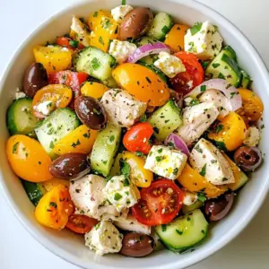 Here are the simple yet tasty ingredients for your Feta Chicken Salad: - 2 cups cooked chicken breast, diced into bite-sized pieces - 1 cup cherry tomatoes, perfectly halved - 1 medium cucumber, diced into refreshing cubes - 1/2 medium red onion, thinly sliced for a mild tang - 1 cup Kalamata olives, pitted and halved for bold flavor - 1 cup feta cheese, generously crumbled for creaminess - 1/4 cup fresh parsley, finely chopped for a burst of herbal freshness - 3 tablespoons extra virgin olive oil for richness - 2 tablespoons freshly squeezed lemon juice for brightness - Salt and freshly ground black pepper to taste Each ingredient plays a role in making this salad shine. The chicken adds protein, while the tomatoes and cucumber bring freshness. Kalamata olives add a salty punch. Feta cheese provides a creamy texture that binds everything together. Fresh parsley adds color and a hint of herb flavor. The olive oil and lemon juice dressing enhances the salad with richness and zing. Together, these ingredients create a balanced and delightful dish. {{ingredient_image_2}} First, take your cooked chicken breast. Dice it into bite-sized pieces. Then, grab your cherry tomatoes and cut them in half. Next, chop your cucumber into refreshing cubes. Finally, slice the red onion thinly. This gives the salad a nice mild tang and adds crunch. Now, it&rsquo;s time to mix all the tasty bits. Add the olives and feta cheese to your bowl. When mixing, fold gently to keep the feta intact. Folding helps keep the salad light and fluffy, unlike tossing, which can break the cheese. In a small bowl, whisk together three tablespoons of extra virgin olive oil with two tablespoons of lemon juice. It should look smooth and well mixed. Add salt and freshly ground black pepper to taste. This dressing brings brightness to your salad. Drizzle your dressing over the salad mix. Use a large spoon to toss everything gently. Make sure all the ingredients get coated evenly. After that, fold in the freshly chopped parsley. This adds a burst of flavor and a pop of green. Let your salad rest for at least ten minutes. This time allows the flavors to blend perfectly. For a beautiful presentation, serve it in a large bowl or on plates. Garnish with extra parsley and a few whole olives on top. This adds flair and makes it more inviting. Enjoy your delightful feta chicken salad! - Use fresh, high-quality ingredients. Choose ripe tomatoes and firm cucumbers. - Store leftover salad in an airtight container. Keep it in the fridge for up to 2 days. - Add fresh herbs like dill or basil for extra flavor. - Consider toppings like avocado slices or roasted nuts for crunch. - Pair the salad with crusty bread or pita chips. - Serve it at picnics, barbecues, or casual family dinners for a tasty treat. Pro Tips Use Fresh Ingredients: Opt for the freshest vegetables and herbs you can find to enhance the overall flavor and presentation of the salad. Chill Before Serving: Allow the salad to chill in the refrigerator for 30 minutes before serving to let the flavors develop and the salad become refreshing. Experiment with Cheese: While feta adds great flavor, try substituting it with goat cheese or a tangy blue cheese for a different twist on this salad. Customize Your Dressing: Feel free to add herbs like oregano or dill to the dressing for an extra layer of flavor that complements the ingredients beautifully. {{image_4}} You can switch the chicken for turkey or tofu. Turkey has a similar taste and texture. It works well in salads and is easy to find. Tofu is a great choice for a plant-based option. It absorbs flavors well, making it tasty. Simply cube the tofu and cook it until golden. If you want to change the cheese, try goat cheese or mozzarella. Goat cheese adds a tangy flavor that pairs nicely with the salad. It also melts well when mixed in. Mozzarella is mild and creamy, giving a different texture. Both choices bring their own flair to the dish. You can use seasonal veggies to keep your salad fresh. In summer, add bell peppers or zucchini. They add crunch and bright colors. In fall, consider roasted butternut squash or sweet potatoes. These add warmth and sweetness. Changing the veggies keeps your salad exciting all year round. To keep your feta chicken salad fresh, store it in an airtight container. Make sure the lid is sealed tightly. This helps prevent air from getting in and keeps the salad crisp. You can also cover the bowl with plastic wrap if you don't have a container. Avoid letting the salad sit out at room temperature for too long. If it's left out for more than two hours, it's best to throw it away. Your feta chicken salad stays fresh in the fridge for about three days. After that, the flavors may fade and the veggies can become soggy. If you notice any changes in color or smell, it's time to discard it. Always trust your senses when deciding if food is still good to eat. It's not a good idea to freeze the salad. Freezing can change the texture of the veggies and feta cheese. When thawed, they may become mushy. If you want to prepare ahead, consider freezing the chicken and dressing separately. You can mix them in once you're ready to enjoy your salad! You can add many tasty items to your feta chicken salad. Here are some great options: - Avocado for creaminess - Bell peppers for crunch - Spinach or arugula for greens - Quinoa for extra protein - Nuts like walnuts for a nice bite These additions can enhance flavor and texture, making the salad even better. Meal prepping feta chicken salad is easy and fun. Here are some tips: - Cook chicken in advance and cool it down. - Chop veggies a day ahead to save time. - Store ingredients separately to keep them fresh. - Mix everything just before eating for the best taste. This way, you can enjoy your salad all week long! Yes, feta cheese is a healthy choice! Here are some benefits: - Lower in calories than many other cheeses. - Rich in calcium, which helps bones. - Provides protein for muscle health. - Contains probiotics, aiding gut health. Feta can be a tasty part of a balanced diet. This blog post guides you through making a tasty feta chicken salad. You learned about fresh ingredients, easy steps, and how to make a great dressing. We discussed storage tips and variations to keep your salad exciting. To wrap it up, feel free to mix and match ingredients based on your taste. Enjoy trying out new flavors and share this delicious dish with friends. A good salad should make you happy and healthy!