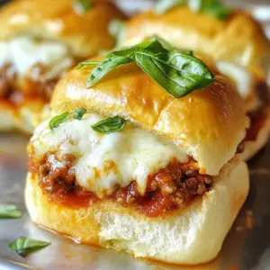 To make Italian grinder sliders, you need some key ingredients. Each one plays a part in creating that rich flavor. - 1 pound ground beef and 1 pound Italian sausage - 1 small onion, finely chopped - 2 cloves garlic, minced - 1 teaspoon dried oregano - 1 teaspoon Italian seasoning - 1/2 teaspoon red pepper flakes (optional, for added heat) - 1 cup marinara sauce - 12 slider buns - 1 cup shredded mozzarella cheese - 1/2 cup grated Parmesan cheese - Fresh basil leaves, for garnish These ingredients work together to build a tasty slider. The ground beef and sausage give it depth, while the onions and garlic add a nice base flavor. The spices bring warmth and a hint of heat if you choose to add red pepper flakes. Marinara sauce ties it all together, adding moisture and richness. Don't forget the cheeses! Mozzarella melts beautifully, while Parmesan adds a sharp note. Finally, fresh basil not only looks nice but brings a burst of freshness. Gather these ingredients, and you're ready to create a mouthwatering dish. Let's dive into the steps to make these sliders shine! {{ingredient_image_2}} First, I heat a large skillet over medium heat. I add 1 pound of ground beef and 1 pound of Italian sausage, breaking up the meat with a wooden spoon. I cook this for about 8-10 minutes until it turns brown and is fully cooked. Next, I add 1 small finely chopped onion and 2 cloves of minced garlic. I saut&eacute; these for 3-4 minutes until the onion is soft. Then, I mix in 1 teaspoon of dried oregano and 1 teaspoon of Italian seasoning. If you like heat, add 1/2 teaspoon of red pepper flakes. I let this cook for another minute to bring out the flavors. Finally, I pour in 1 cup of marinara sauce and stir well. I let this simmer for about 5 minutes to blend the flavors nicely. Now, I preheat my oven to 375&deg;F (190&deg;C). I slice 12 slider buns in half and place the bottom halves in a baking dish. I spoon the meat mixture generously over these buns, spreading it evenly. Next, I sprinkle 1 cup of shredded mozzarella cheese on top, followed by 1/2 cup of grated Parmesan cheese. I press the top halves of the buns gently over the cheese layer. I cover the baking dish with aluminum foil and place it in the preheated oven for 15 minutes. After that, I carefully remove the foil and bake for another 10 minutes. This step helps the tops of the buns become golden brown and the cheese bubble up. Once baked, I take them out and let them cool for a few minutes. I garnish with fresh basil leaves before serving to add a lovely touch. To make your sliders pop, adjust the seasoning. Try adding more red pepper flakes for heat. If you like it mild, skip them. I often use homemade marinara. It gives a fresh taste. Store-bought sauces save time but may lack depth. Serve these sliders on a big wooden board. Add a bowl of marinara for dipping. Pair them with crispy potato chips or a fresh salad. This combo brings balance and crunch. Chop your onions and garlic small for even cooking. Use a sharp knife to save time. When cooking meat, keep the heat medium. This helps it brown nicely without burning. Break up the meat as it cooks for the best texture. Pro Tips Mixing Meats: Combine different types of ground meats for a richer flavor profile. The blend of ground beef and Italian sausage adds depth to the sliders. Cheese Options: Experiment with different cheeses like provolone or fontina for a unique twist on the classic flavor. These can melt beautifully and add a different taste. Make Ahead: Prepare the meat mixture a day in advance and store it in the fridge. This allows the flavors to develop further and makes the assembly quicker on the day of serving. Serving Suggestions: Pair the sliders with a fresh side salad or crispy potato wedges for a complete meal experience. It balances the richness of the sliders perfectly. {{image_4}} You can change the cheese for your Italian grinder sliders. Provolone adds a nice flavor. It melts well and gives a creamy bite. Cheddar is another good choice. It brings a sharp taste that contrasts with the meat. If you want a twist, try fontina. It's rich and smooth. Mix and match cheeses for your perfect blend. You can make these sliders vegetarian too! Use plant-based ground meat instead of beef and sausage. There are many options on the market now. You can even use chopped mushrooms or lentils for texture. They add a nice earthy flavor and are very filling. Don&rsquo;t forget to add extra spices to boost the taste! You can make your marinara sauce just how you like it. If you like heat, add red pepper flakes for a spicy kick. You can also toss in extra veggies. Chopped bell peppers or spinach can add color and nutrients. Simmer these veggies in the sauce to let the flavors blend. This gives your sliders a fresh and tasty twist! To keep your Italian grinder sliders fresh, let them cool first. Place them in an airtight container. Use parchment paper between layers to avoid sticking. Store in the fridge for up to three days. This way, they stay tasty and safe to eat. You can freeze these sliders for later. First, assemble the sliders but do not bake them. Wrap each slider tightly in plastic wrap. Then, place them in a freezer bag. They can stay good for up to three months. When you're ready to eat, thaw them in the fridge overnight. To reheat, bake at 375&deg;F for about 20 minutes until hot. In the fridge, your sliders last about three days. If you freeze them, they can last up to three months. Always check for any signs of spoilage before eating. Enjoy them fresh for the best taste! Bake your Italian grinder sliders for 25 minutes. First, cover them with foil for 15 minutes. Then, remove the foil and bake for 10 more minutes. This helps the tops get golden brown and the cheese melt nicely. Yes, you can prep these sliders ahead. Assemble them and keep them covered in the fridge. Bake them just before serving for the best taste. This makes it easy for parties or gatherings. Great sides include: - Crispy potato wedges - Fresh garden salad - Garlic bread - Coleslaw These sides balance the rich flavors of the sliders. To reheat, place sliders in the oven at 350&deg;F (175&deg;C). Heat for about 10-15 minutes. This keeps them warm and the cheese melty. You can also microwave them for a quicker option. They can be spicy! The red pepper flakes add heat if you choose to use them. If you want less spice, just skip them. The flavors still shine through without the spice. Use soft slider buns for the best texture. Here are some great options: - Hawaiian rolls - Potato buns - Mini ciabatta These choices add flavor and hold the filling well. This post shared how to make delicious Italian grinder sliders. You learned about the key ingredients, like ground beef, sausages, and cheeses. I gave you step-by-step instructions, plus tips to perfect the flavors. You can even explore variations, from vegetarian options to different cheeses. Lastly, I explained how to store your sliders for later. No matter your choice, these sliders promise satisfaction! Enjoy your cooking and the tasty results.